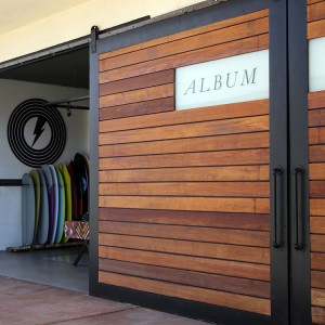 Album surfboards retail shop with custom sliding doors